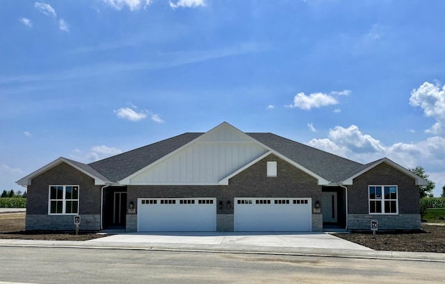 15959 Prairie View Ct Unit T6, New Lenox, IL 60451 - view of front of property with an attached garage, board and batten siding, stone siding, concrete driveway, and a shingled roof