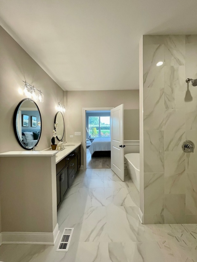 15959 Prairie View Ct Unit T6, New Lenox, IL 60451 - bathroom featuring marble look tiles, a freestanding bath, tiled shower, ensuite bath, and vanity