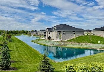 15959 Prairie View Ct Unit T6, New Lenox, IL 60451 - rear view of house featuring a water view and a lawn