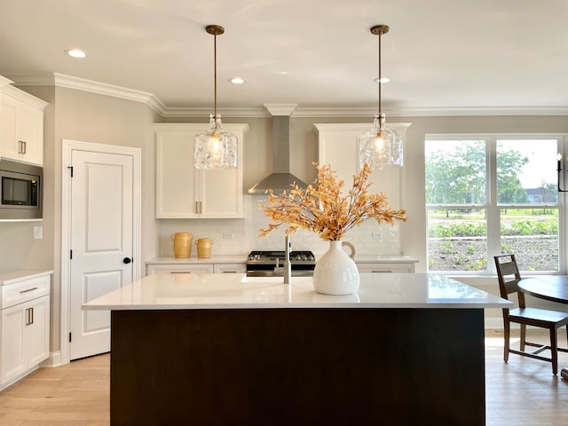 15959 Prairie View Ct Unit T6, New Lenox, IL 60451 - kitchen featuring wall chimney range hood, appliances with stainless steel finishes, backsplash, light wood-type flooring, and white cabinetry