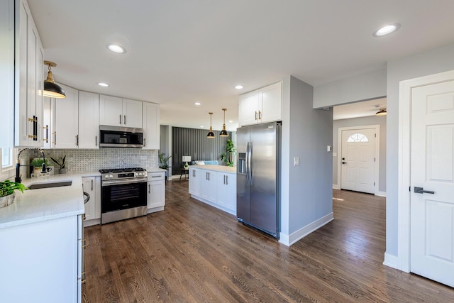 22W046 Mccormick Ave, Glen Ellyn, IL 60137 - kitchen with stainless steel appliances, a sink, white cabinetry, tasteful backsplash, and light countertops