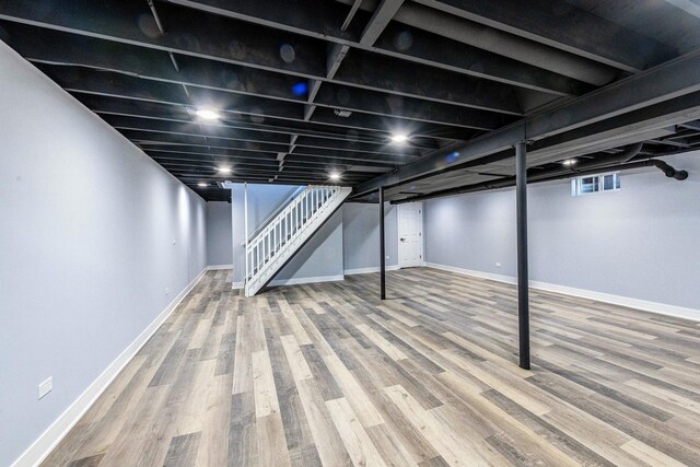 22W046 Mccormick Ave, Glen Ellyn, IL 60137 - basement with stairs, wood finished floors, and baseboards