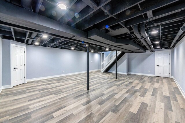 22W046 Mccormick Ave, Glen Ellyn, IL 60137 - finished basement featuring wood finished floors, stairway, and baseboards