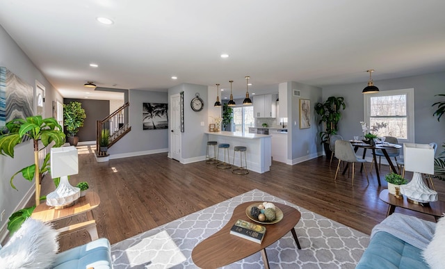 22W046 Mccormick Ave, Glen Ellyn, IL 60137 - living room featuring stairway, baseboards, dark wood-style flooring, and recessed lighting