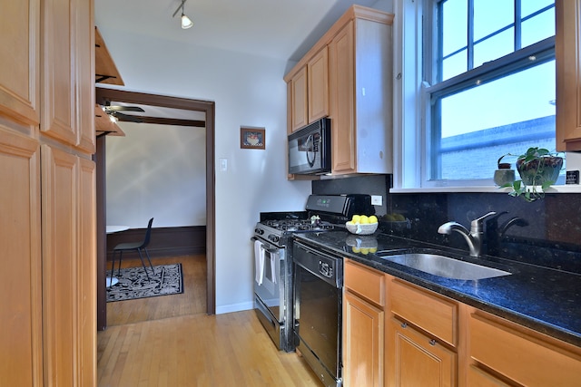 226 N Oak Park Ave Unit 3N, Oak Park, IL 60302 - kitchen featuring black appliances, a sink, light wood finished floors, light brown cabinetry, and dark stone counters
