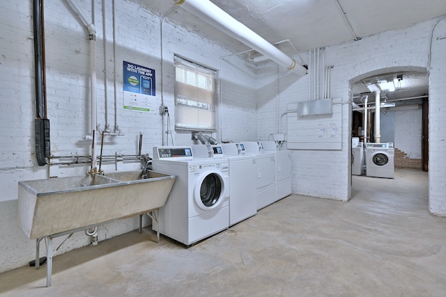 226 N Oak Park Ave Unit 3N, Oak Park, IL 60302 - shared laundry room with washing machine and dryer and brick wall