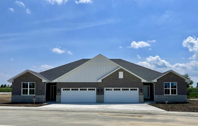 LOTT1015950 Prairie View Ct, New Lenox, IL 60451 - view of front of property with an attached garage, board and batten siding, stone siding, concrete driveway, and a shingled roof