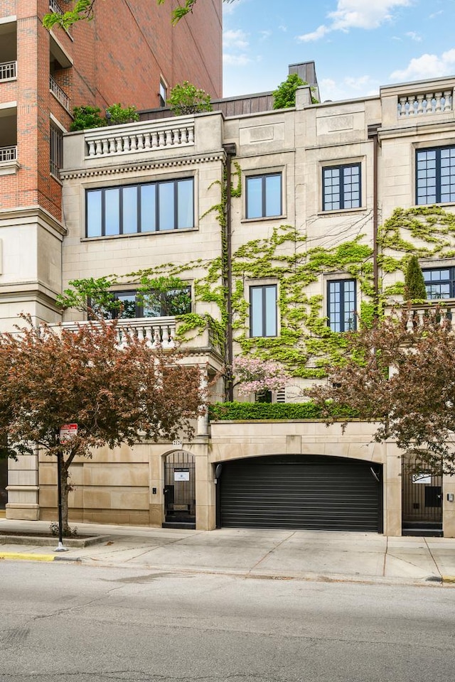 2124 N Lincoln Park W, Chicago, IL 60614 - view of building exterior featuring an attached garage and concrete driveway