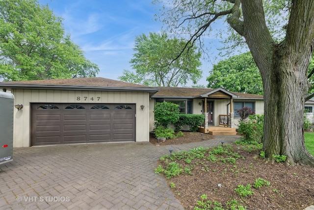 8747 Merrimac Ave, Oak Lawn, IL 60453 - single story home with an attached garage and decorative driveway
