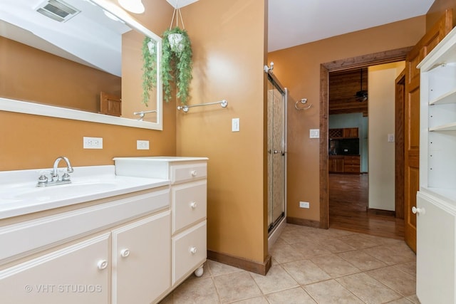 8747 Merrimac Ave, Oak Lawn, IL 60453 - full bathroom with vanity, tile patterned flooring, a stall shower, and baseboards