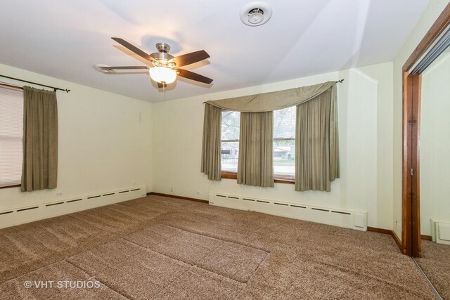 8747 Merrimac Ave, Oak Lawn, IL 60453 - carpeted spare room featuring a baseboard heating unit, ceiling fan, and baseboards
