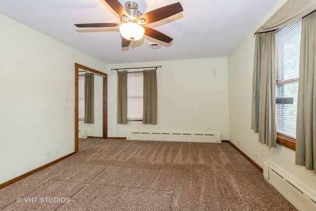 8747 Merrimac Ave, Oak Lawn, IL 60453 - empty room featuring baseboard heating, carpet floors, and plenty of natural light