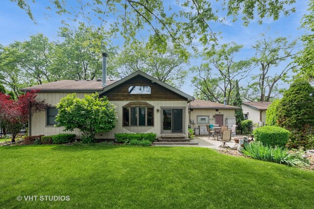 8747 Merrimac Ave, Oak Lawn, IL 60453 - back of property featuring a patio and a lawn