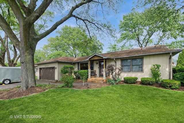8747 Merrimac Ave, Oak Lawn, IL 60453 - ranch-style house with a garage, a front lawn, and driveway