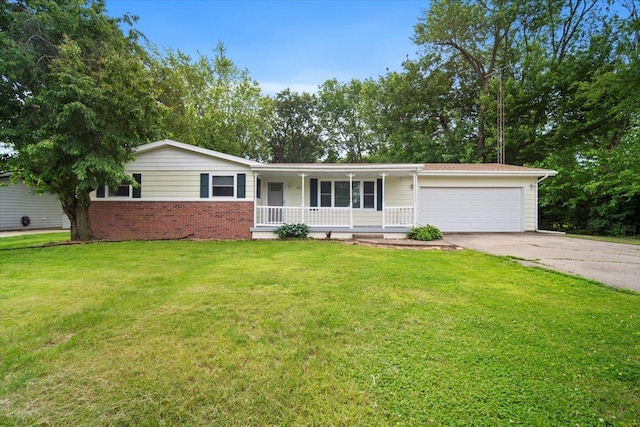 8491 Surrey Cir, Bloomington, IL 61705 - ranch-style house with covered porch, concrete driveway, an attached garage, a front lawn, and brick siding