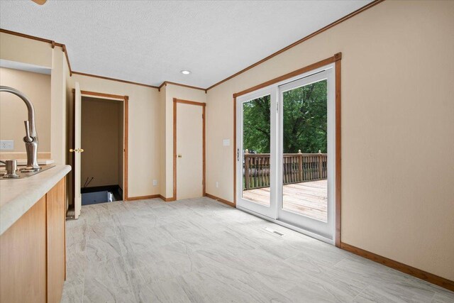 8491 Surrey Cir, Bloomington, IL 61705 - unfurnished living room with ornamental molding, baseboards, light colored carpet, and a textured ceiling