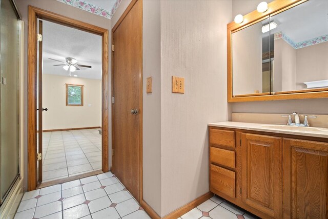 8491 Surrey Cir, Bloomington, IL 61705 - bathroom featuring a ceiling fan, vanity, and baseboards
