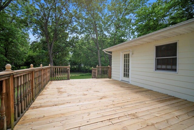 8491 Surrey Cir, Bloomington, IL 61705 - wooden terrace featuring view of wooded area