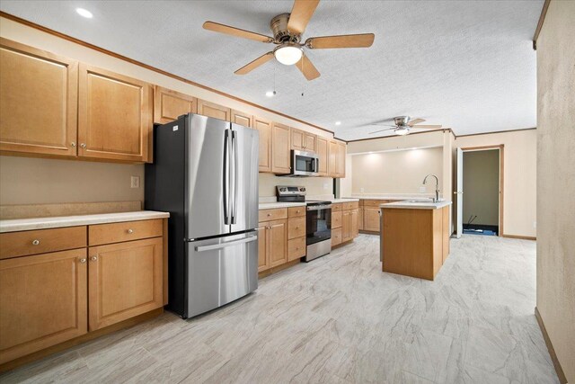 8491 Surrey Cir, Bloomington, IL 61705 - kitchen with stainless steel appliances, ceiling fan, light countertops, a sink, and recessed lighting