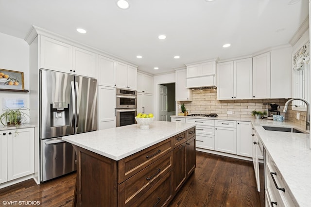 21298 N Andover Rd, Kildeer, IL 60047 - kitchen with appliances with stainless steel finishes, a sink, white cabinetry, light stone countertops, and ornamental molding