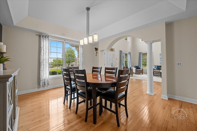 36W703 Whispering Trl, Saint Charles, IL 60175 - dining area with decorative columns, arched walkways, baseboards, light wood finished floors, and a raised ceiling