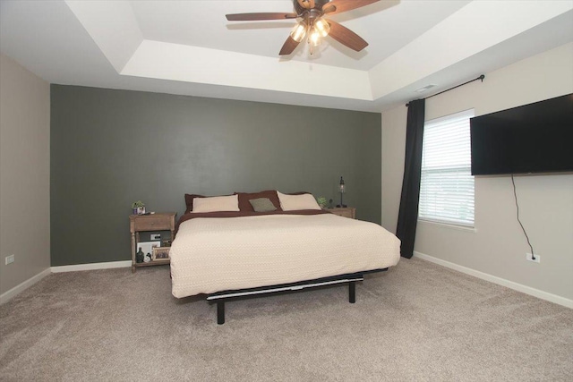 1901 Taos Ln, Volo, IL 60020 - carpeted bedroom featuring a tray ceiling, baseboards, and ceiling fan