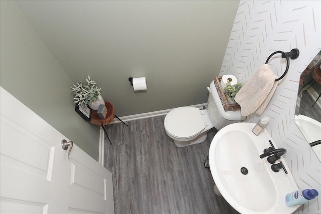 1901 Taos Ln, Volo, IL 60020 - half bathroom with wood finished floors, toilet, a sink, and baseboards