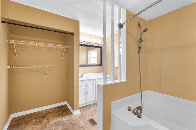 116 Seminole Ln, Loda, IL 60948 - full bathroom featuring vanity, baseboards, and a walk in closet