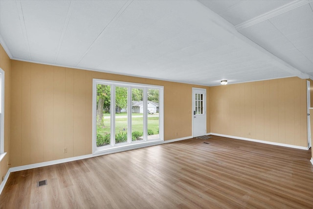 116 Seminole Ln, Loda, IL 60948 - spare room featuring wood finished floors, baseboards, and wooden walls