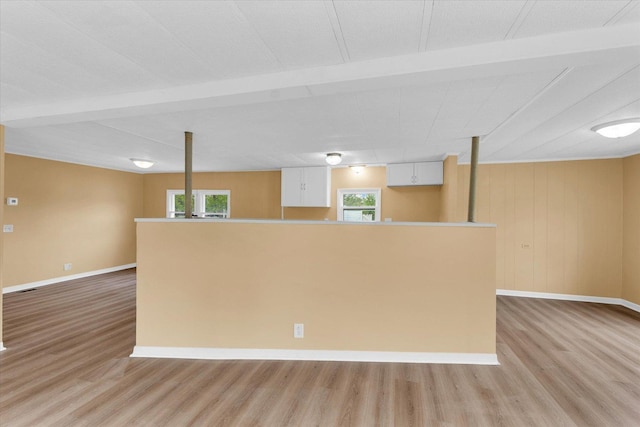 116 Seminole Ln, Loda, IL 60948 - kitchen with light wood finished floors, white cabinetry, healthy amount of natural light, baseboards, and beamed ceiling