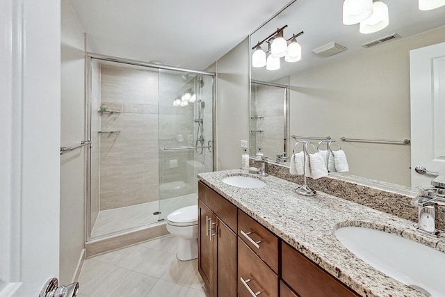 460 W Deming Pl Unit 1E, Chicago, IL 60614 - bathroom with double vanity, tile patterned flooring, toilet, and a stall shower
