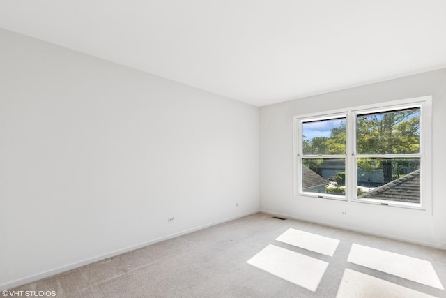867 Downing Sq, Lincolnshire, IL 60069 - spare room featuring light colored carpet and baseboards