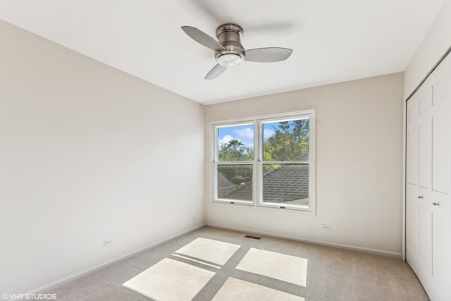867 Downing Sq, Lincolnshire, IL 60069 - unfurnished bedroom featuring a closet, light colored carpet, and baseboards