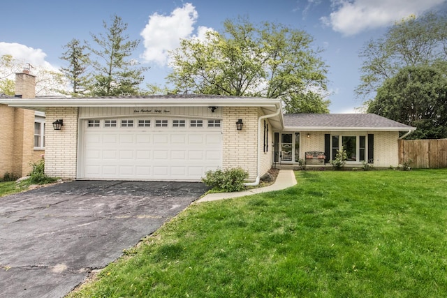 133 W King George Ct, Palatine, IL 60067 - view of front of property with brick siding, driveway, an attached garage, and a chimney