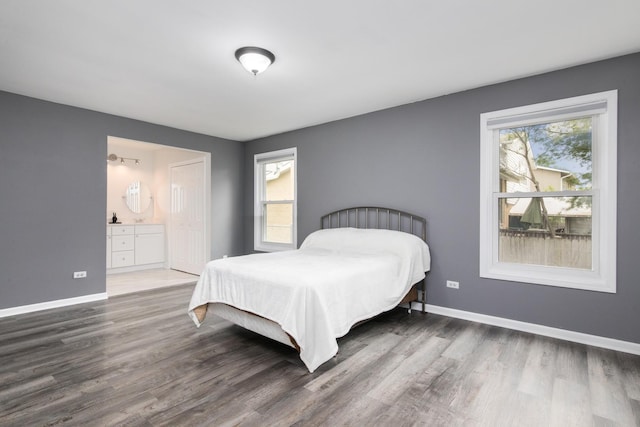 133 W King George Ct, Palatine, IL 60067 - bedroom featuring wood finished floors, baseboards, and connected bathroom