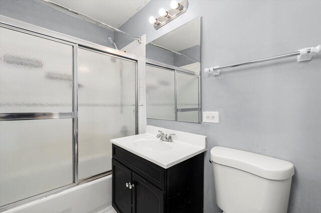 7546 W 61st St, Summit, IL 60501 - bathroom featuring shower / bath combination with glass door, vanity, and toilet