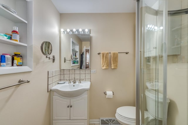 365 S Elm St, Itasca, IL 60143 - bathroom with backsplash, toilet, a shower stall, and vanity