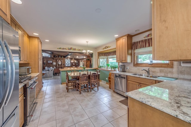 365 S Elm St, Itasca, IL 60143 - kitchen featuring stainless steel appliances, a sink, light tile patterned floors, tasteful backsplash, and recessed lighting