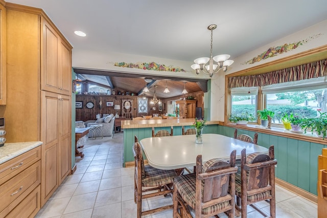 365 S Elm St, Itasca, IL 60143 - dining area with a chandelier, light tile patterned flooring, and wood walls