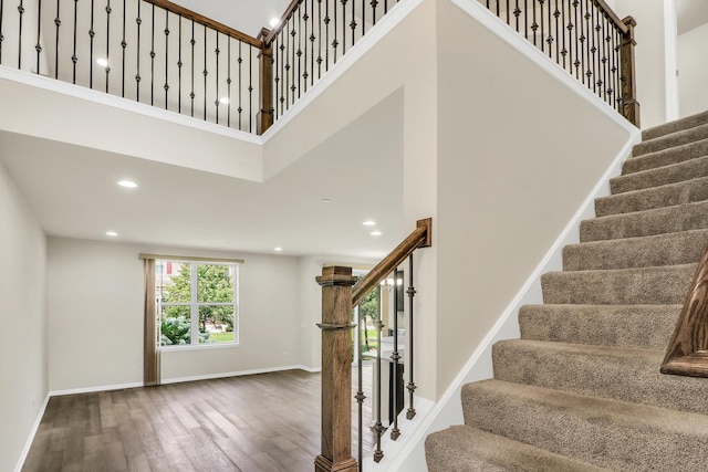 415 Highcroft Way, Lincolnshire, IL 60069 - stairway with wood finished floors, baseboards, a towering ceiling, and recessed lighting