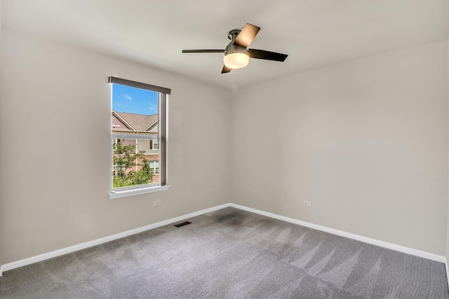 415 Highcroft Way, Lincolnshire, IL 60069 - spare room featuring baseboards, dark colored carpet, and a ceiling fan