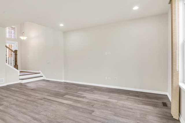 415 Highcroft Way, Lincolnshire, IL 60069 - empty room with stairs, wood finished floors, baseboards, and recessed lighting