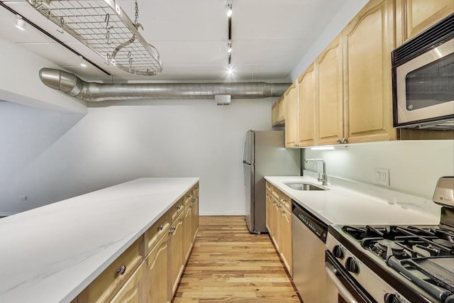 1430 S Michigan Ave Unit 311, Chicago, IL 60605 - kitchen featuring appliances with stainless steel finishes, light brown cabinetry, light wood finished floors, and track lighting