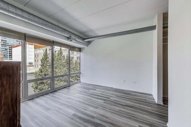 1430 S Michigan Ave Unit 311, Chicago, IL 60605 - unfurnished room featuring plenty of natural light and wood finished floors