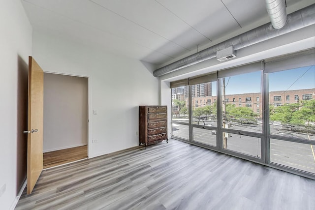 1430 S Michigan Ave Unit 311, Chicago, IL 60605 - spare room with wood finished floors and expansive windows