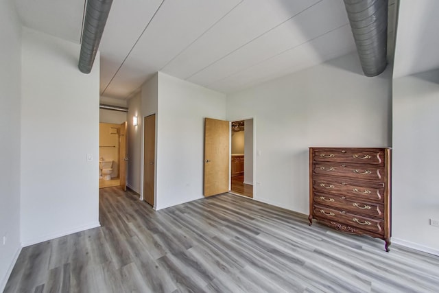 1430 S Michigan Ave Unit 311, Chicago, IL 60605 - unfurnished bedroom featuring wood finished floors and baseboards
