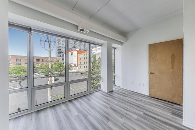 1430 S Michigan Ave Unit 311, Chicago, IL 60605 - unfurnished room with wood finished floors and baseboards