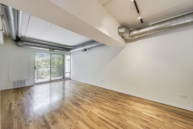 1430 S Michigan Ave Unit 311, Chicago, IL 60605 - spare room featuring rail lighting and wood finished floors