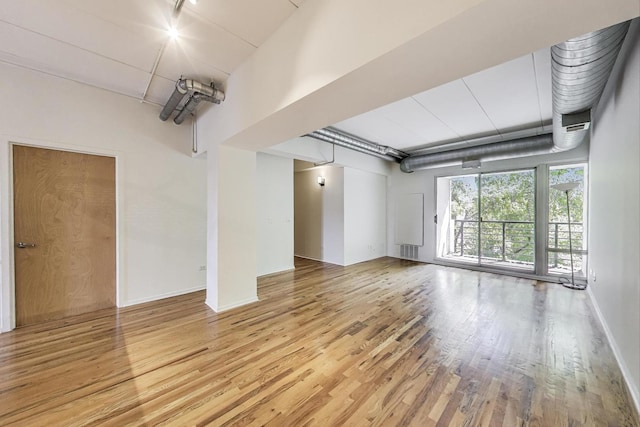 1430 S Michigan Ave Unit 311, Chicago, IL 60605 - empty room featuring wood finished floors and baseboards