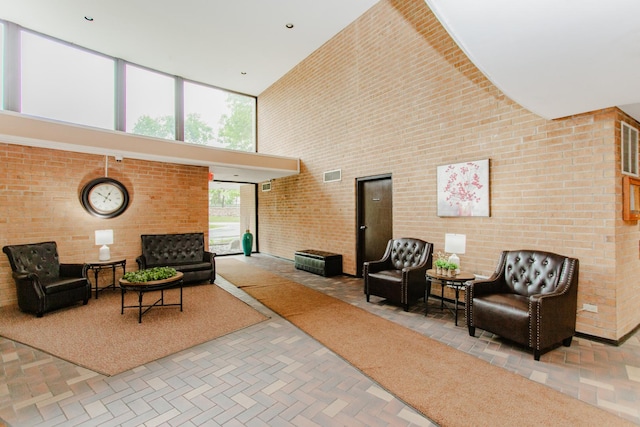 15 Bar Harbour Rd Unit 5A, Schaumburg, IL 60193 - building lobby featuring a high ceiling and brick wall